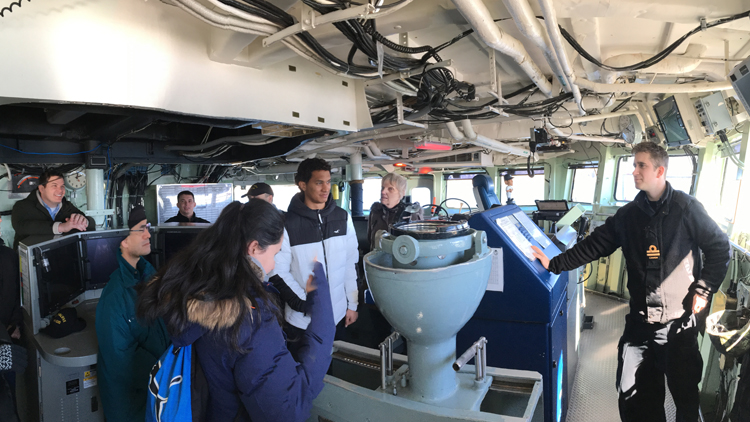 Students on the bridge of a ship