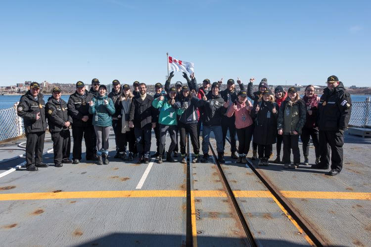 Students on the deck of a ship